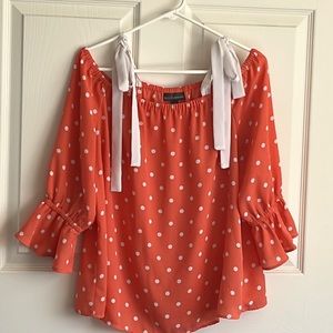 LG orange and white polka dot, sheer, ties on shoulders, blouse.
